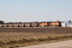 BNSF 5685 & 9067 bring a coal train through town